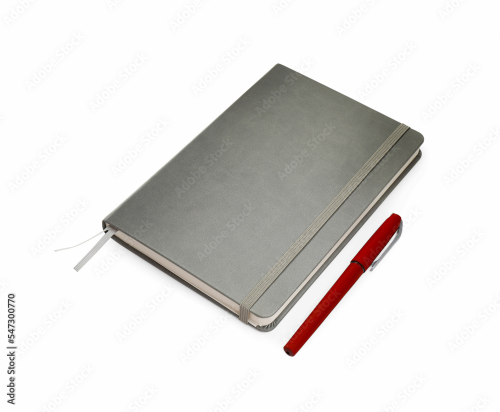 Closed grey notebook with pen isolated on white
