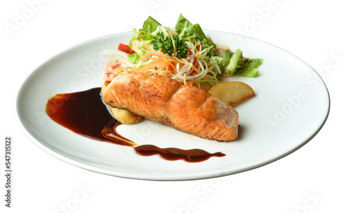 Salmon fillet served with vegetables and potatoes in restaurant menus