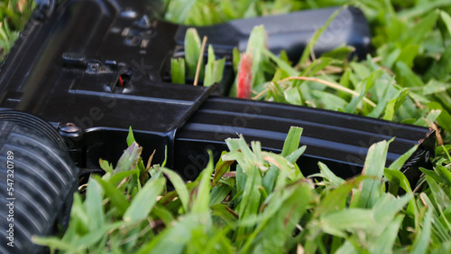 Air soft gun magazine put on the grass