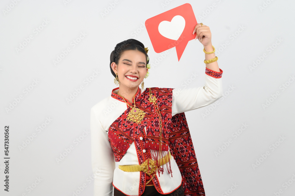 Young beautiful woman in Thai lanna costume with card card in heart symbol