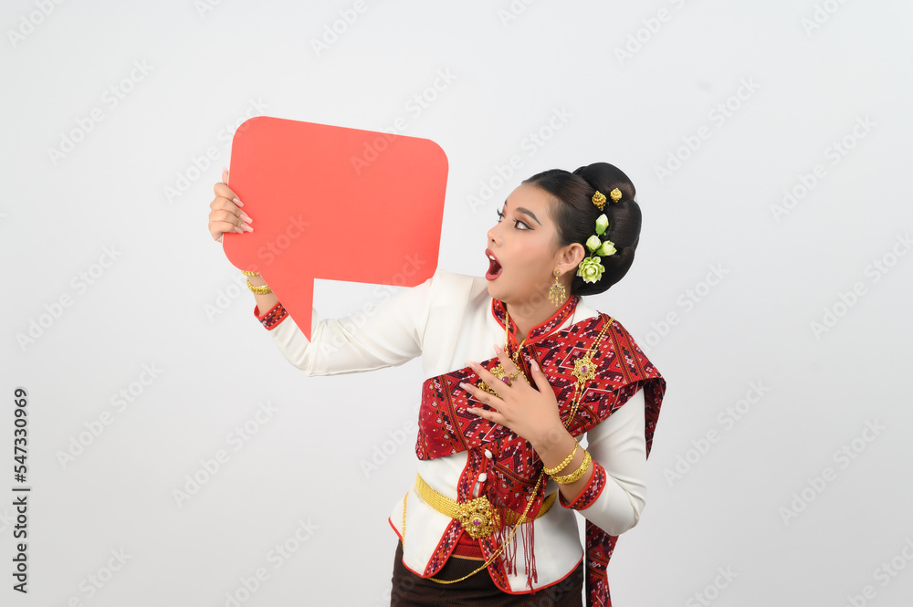 Young beautiful woman in Thai lanna costume with blank speech bubble sign Young beautiful woman in Thai lanna costume with blank speech bubble sign