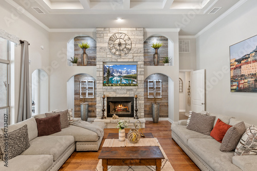A luxury living room with a stone fireplace
