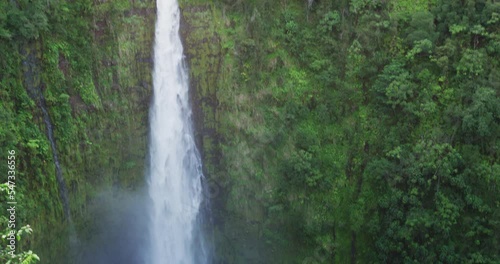 Hawaii Akaka Falls - Hawaiian waterfall on Big Island, Hawaii, USA. Beautiful idyllic nature landscape scene of the famous waterfall, Akaka falls in lush scenery. SLOW MOTION photo