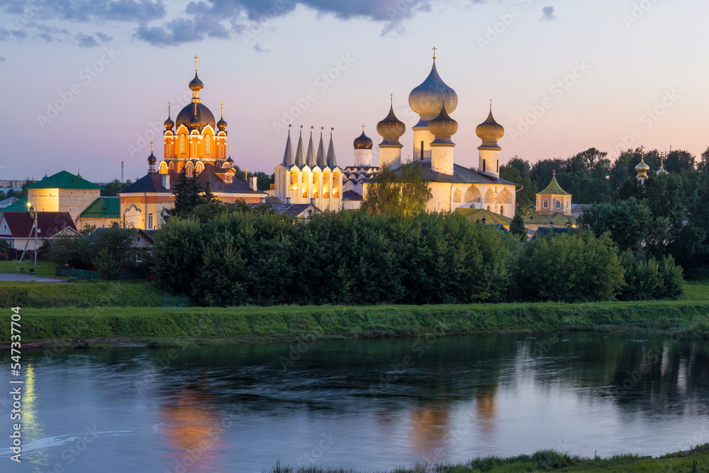 View of the ancient Tikhvin Assumption Monastery in August twilight. Leningrad region, Russia