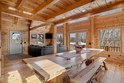 Fotografie Kitchen and living room interior of log cabin in mountains