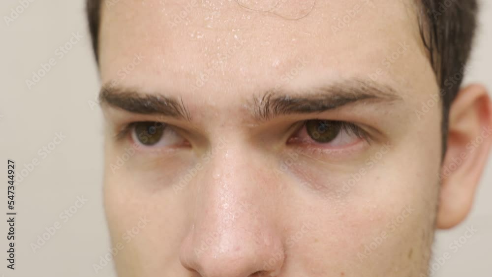 The man who got sick is trying to breathe, he is sweating.
From heat, humidity, fatigue or sick man sweats and becomes depressed.
