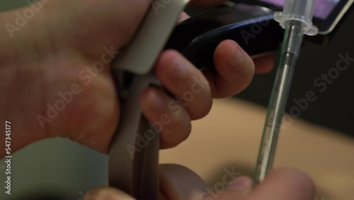 Male doctor puts a tube into the larynx of a manikin using a Video Laryngoscope. Teaching respiratory intubation in the clinic