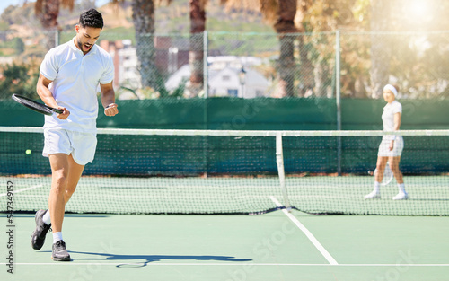 Tennis, celebration and man playing a game to win on an outdoor court for practice, exercise and fitness. Sports, motivation and healthy male athlete training for a match or workout on a sport field.