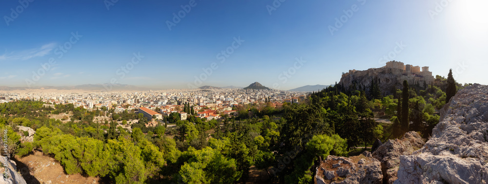 Acropolis and Cityscape in a Historic City with Mountains in Background. Areopagus Hill, Athens, Greece. Sunny Day.