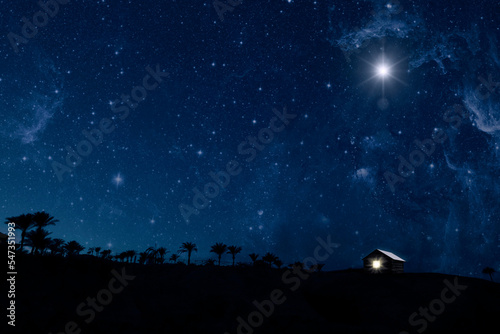 The star shines over the manger of christmas of Jesus Christ. panorama © vovan