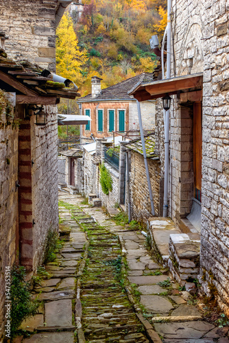 The picturesque village of Dilofo during fall season with its architectural traditional old stone buildings located on Tymfi mount, Zagori, Epirus, Greece, Europe © valantis minogiannis