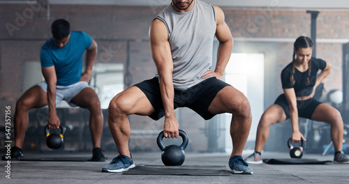Fitness, weightlifting and kettlebell class for arm workout, exercise or training together at the gym. Active people in sports exercising with kettle weights for healthy cardio endurance or wellness