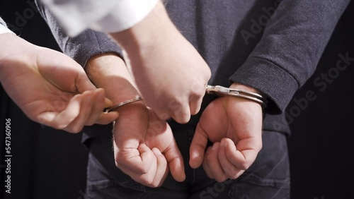The criminal male was handcuffed by the police.
Police aggressively handcuffed the criminal.
