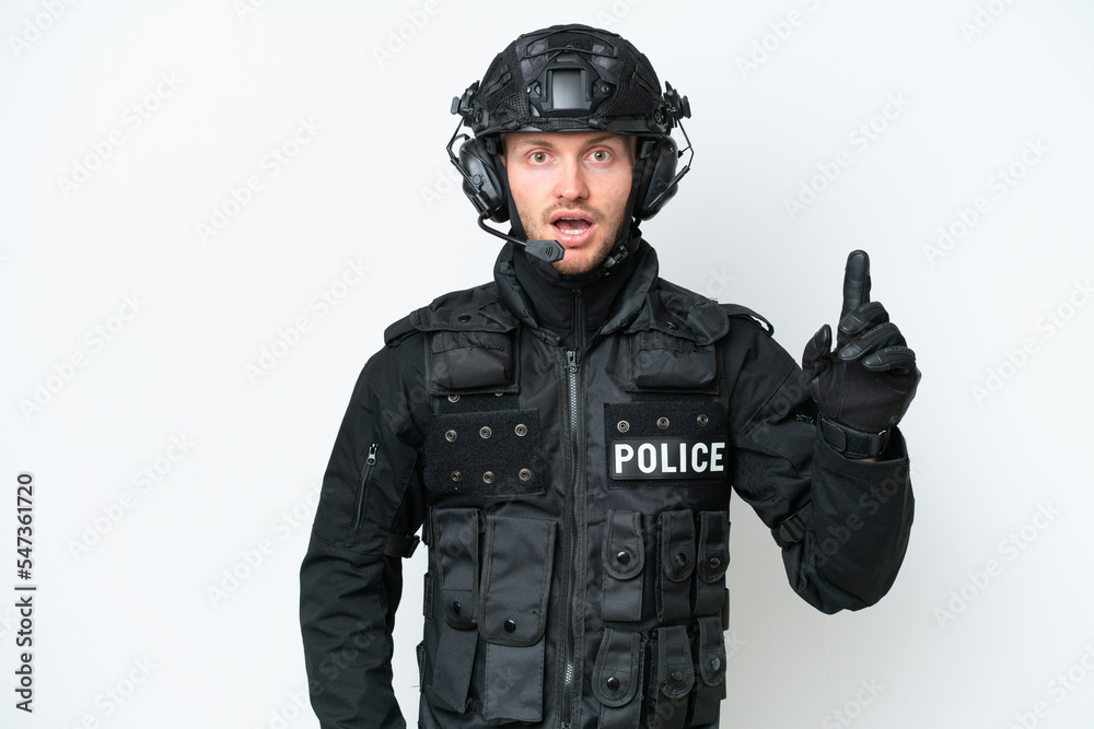 SWAT man over isolated white background thinking an idea pointing the finger up SWAT man over isolated white background thinking an idea pointing the finger up