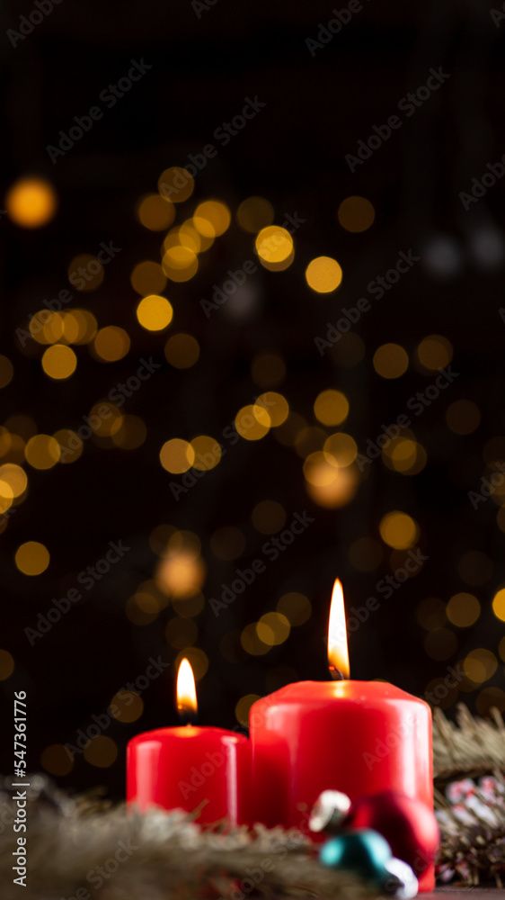 Two burning red candles on the New Year's table Two burning red candles on the New Year's table