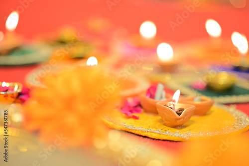 Indian Festival Diwali, Navratri, celebrations vertical picture by lighting colourful Diya Lamps Lights