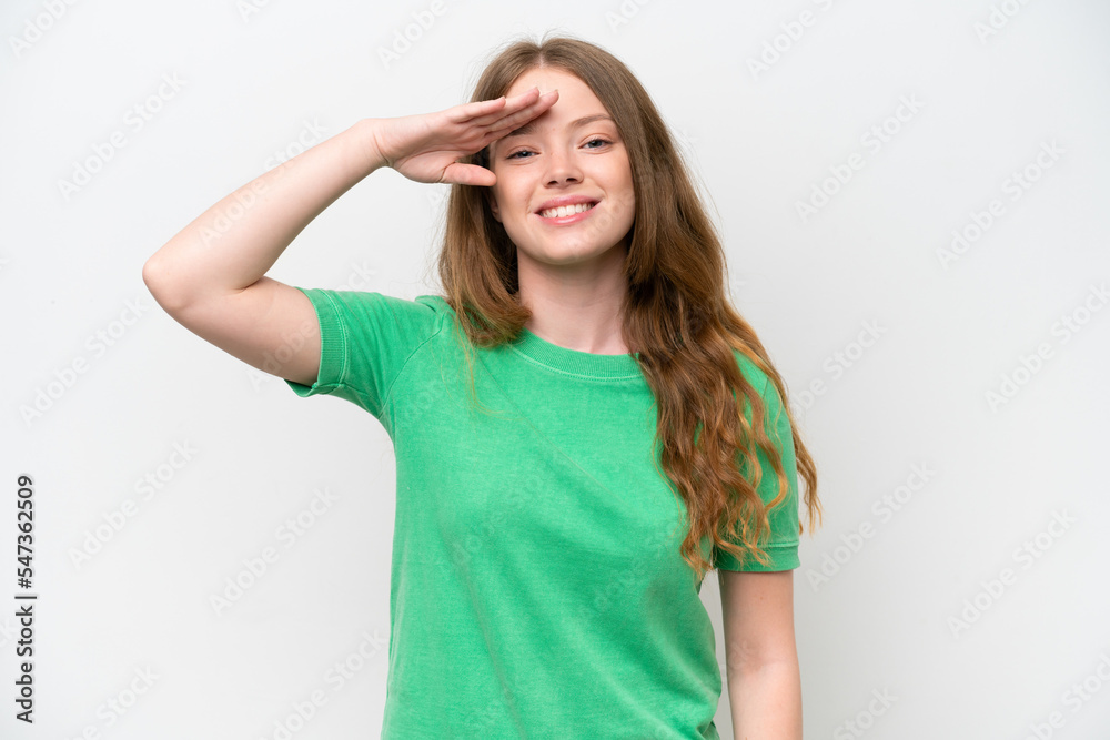 Young pretty woman isolated on white background saluting with hand with happy expression Young pretty woman isolated on white background saluting with hand with happy expression