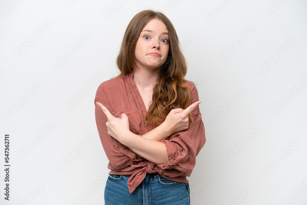 Young pretty woman isolated on white background pointing to the laterals having doubts Young pretty woman isolated on white background pointing to the laterals having doubts
