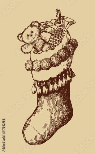 Vintage Christmas stocking full of presents. Trumpet and teddy beard inside.