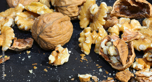 broken shells of walnuts with the edible kernel
