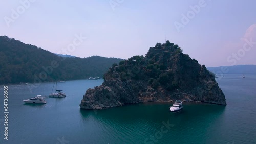 Beautiful seashore. Islands in the distance. Colorful blue sea. The beauty of Turkey. Beautiful rocks and mountains. Sunny clear day. Beautiful water.	