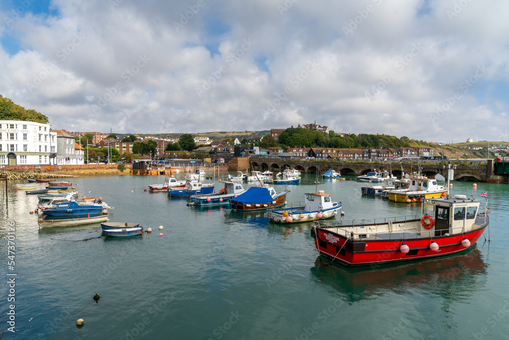 view of the Folkestone Harbour with many boats at anchor