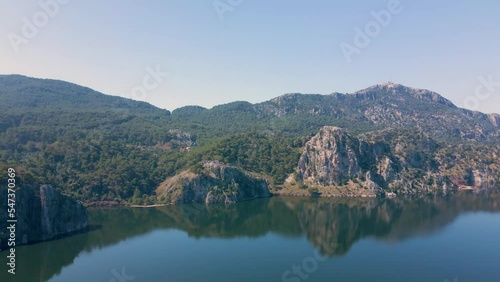 Beautiful seashore. Islands in the distance. Colorful blue sea. The beauty of Turkey. Beautiful rocks and mountains. Sunny clear day. Beautiful water.	