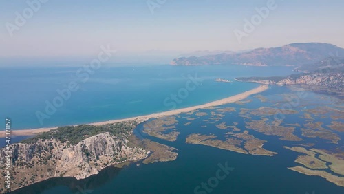Beautiful seashore. Islands in the distance. Colorful blue sea. The beauty of Turkey. Beautiful rocks and mountains. Sunny clear day. Beautiful water.	