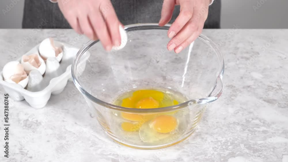 Time lapse. Step by step. Mixing ingredients in a glass mixing bowl to prepare red velvet bundt cake. Time lapse. Step by step. Mixing ingredients in a glass mixing bowl to prepare red velvet bundt cake.