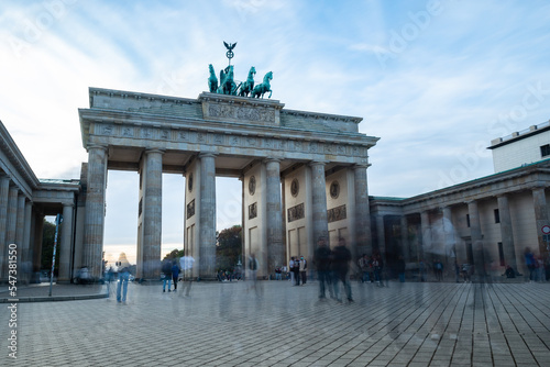 brandenburg gate in berlin tourism germany sightseeing. tourists walking around travel destination