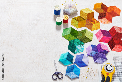 Preparing of bright diamond pieces of fabrics for sewing quilt, sewing and quilting accessories