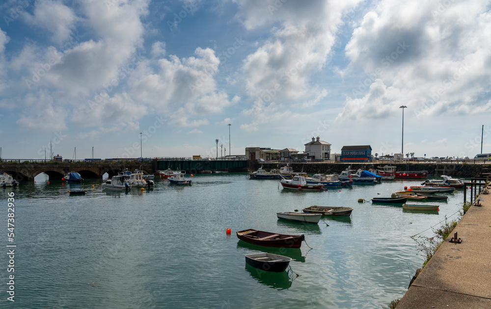 view of the Folkestone Harbour with many boats at anchor