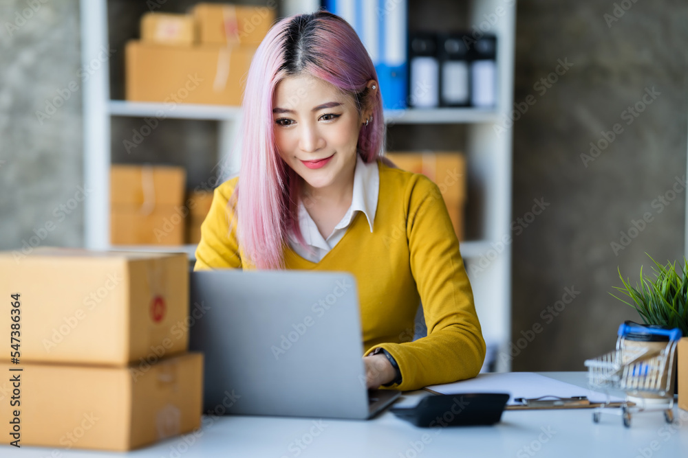 business owner working checking order to confirm before sending customer in post office. business owner working checking order to confirm before sending customer in post office.