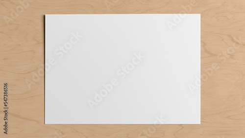 Blank sheet of paper mock up on the wooden table.