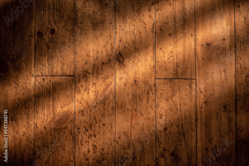 Rough old Wooden retro background with window shadow.