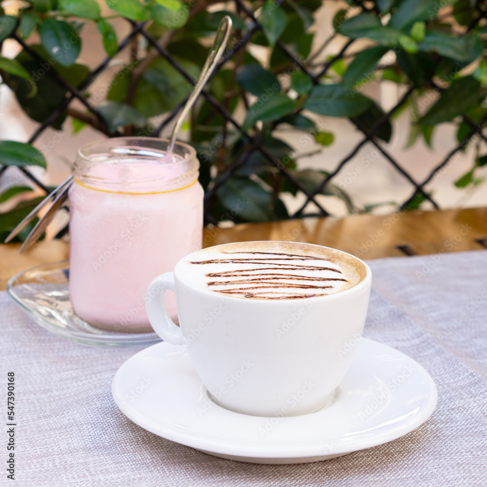 Εκτύπωση καμβά White cup of cappuccino and jar of strawberry ice cream