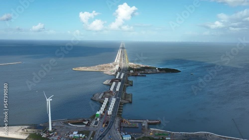 Afsluitdijk construction on pumping stations new sluices and the A7 near Den Oever, Kornwerderzand , and Zurich. Lock for shipping, road traffic cyclists and walkers. Aerial drone view. photo