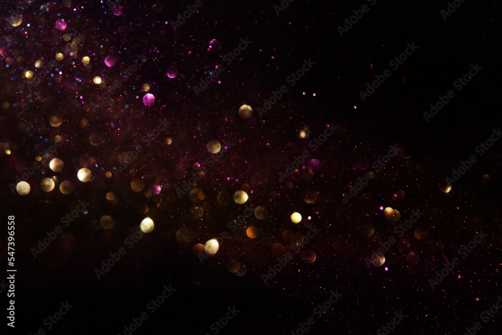 background of abstract glitter lights. gold and black. de focused - obrazy, fototapety, plakaty 