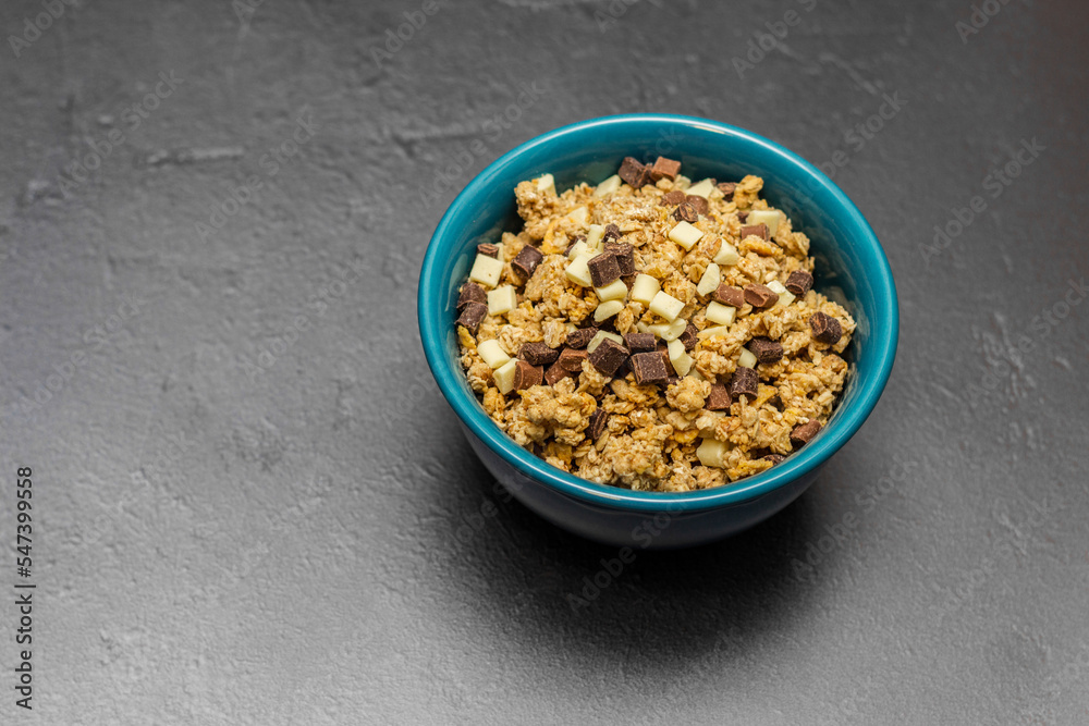 Healthy homemade muesli in a blue bowl