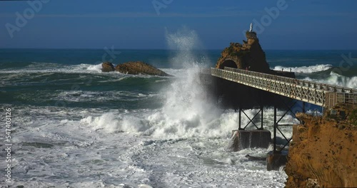 Swell breaking on the famous rock of the Virgin in the city of Biarritz