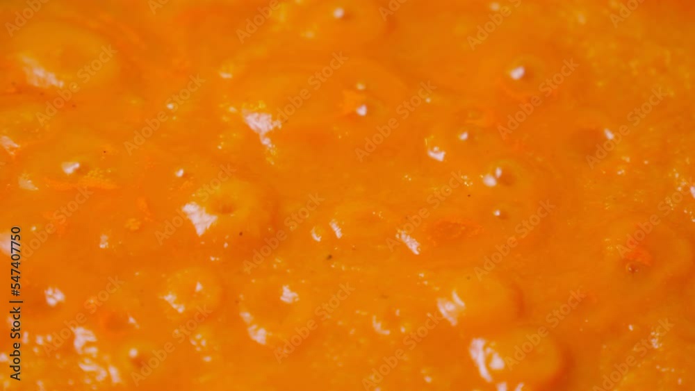 Preparation zucchini caviar. Stewed vegetables zucchini, with carrots and tomato paste, are cooked on the stove. Selective focus Preparation zucchini caviar. Stewed vegetables zucchini, with carrots and tomato paste, are cooked on the stove. Selective focus