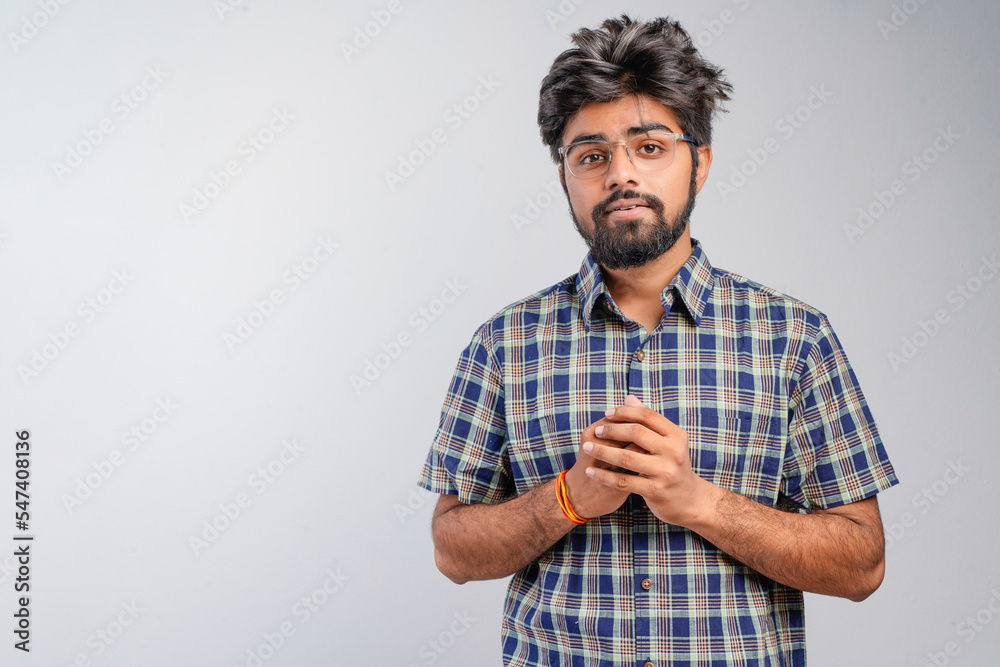 Young Indian businessman against white background Young Indian businessman against white background