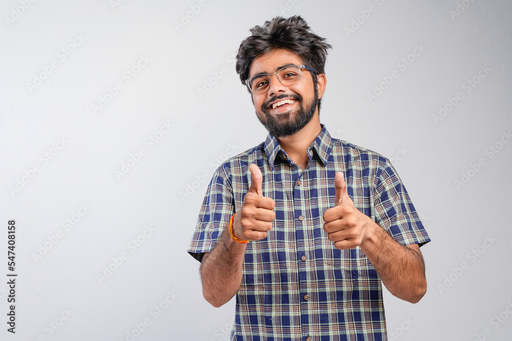 Young Indian businessman against white background Young Indian businessman against white background