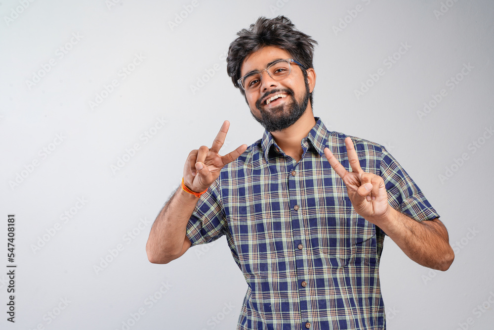Young Indian businessman against white background Young Indian businessman against white background