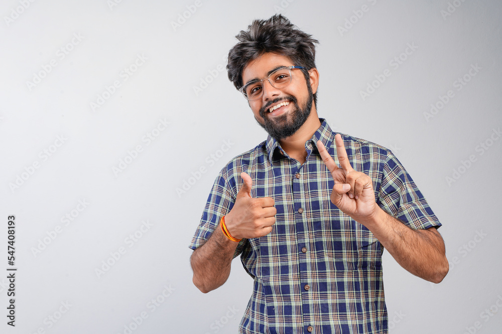 Young Indian businessman against white background Young Indian businessman against white background