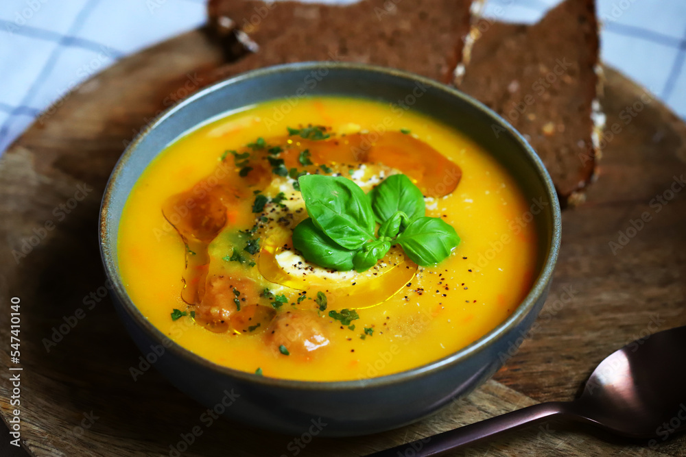 Pumpkin carrot soup with meatballs in a bowl. Autumn menu. Pumpkin carrot soup with meatballs in a bowl. Autumn menu.