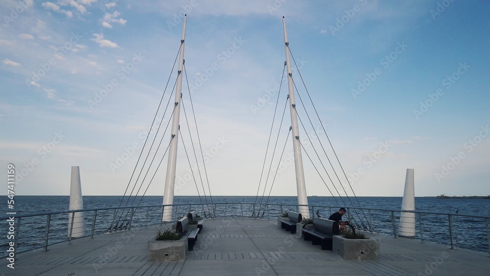Viewpoint of the Rio de la Plata, ship masts, blue sky with clouds