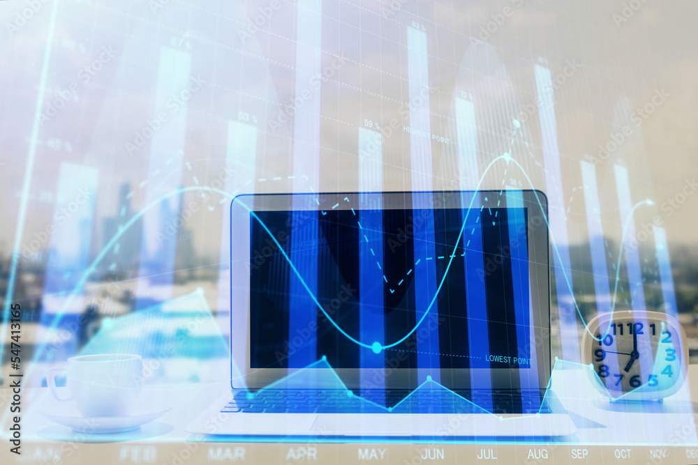 Forex graph hologram on table with computer background. Multi exposure. Concept of financial markets. Forex graph hologram on table with computer background. Multi exposure. Concept of financial markets.
