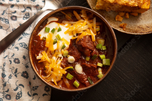 Texas Chili in Rustic Bowl with cornbread photo