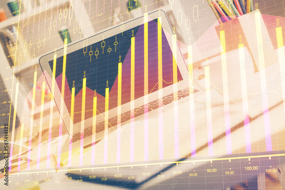 Stock market graph on background with desk and personal computer. Double exposure. Concept of financial analysis. Stock market graph on background with desk and personal computer. Double exposure. Concept of financial analysis.